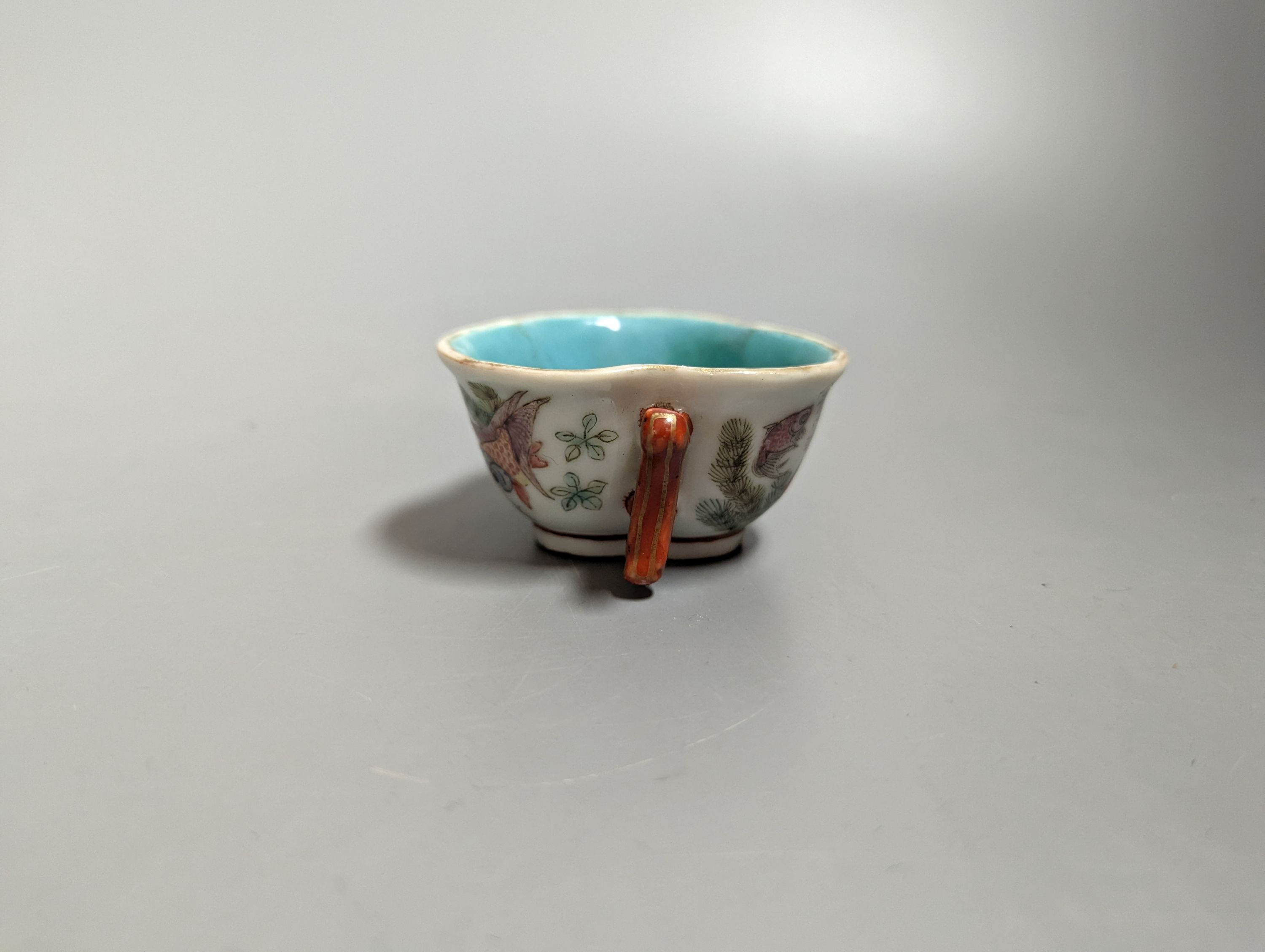 A Chinese enamelled porcelain 'goldfish' cup, Qianlong mark but 19th century, 3cms high